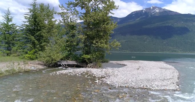 Majestic mountain river in Devis Creek, Vancouver, Canada. Drone flying. Aerial view with mountain background.