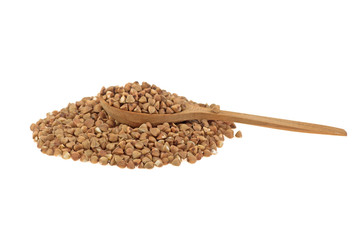heap of buckwheat on wooden spoon isolated on white background