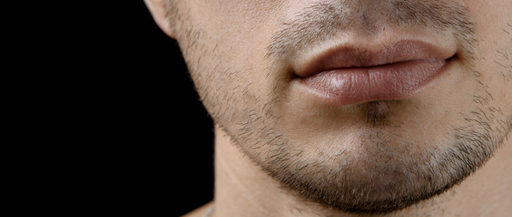 Obraz premium Closeup unshaven chin of a young man