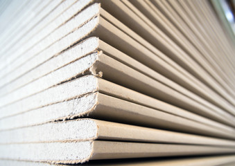 A stack of drywall sheets in stock