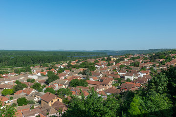 Fototapeta na wymiar Sremski Karlovci, Serbia - May 2, 2018: Panorama of Sremski Karlovci. Panoramic view of the roofs of the house, Chappel of Peace and Danube river.