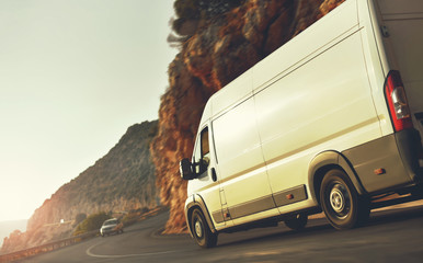 delivery van on countryside road on sunset