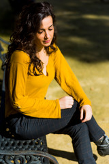 Beautiful woman with brunette hair in the park