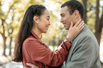 Beautiful loving girl embracing her handsome boy