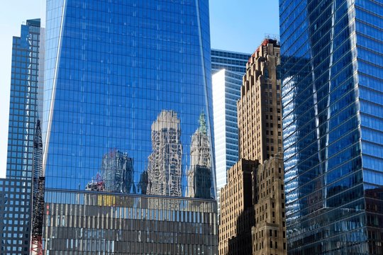 Reflection of the surrounding skyscrapers in the glass facade of the One World Trade Center, Ground Zero, Manhattan, New York, USA, North America