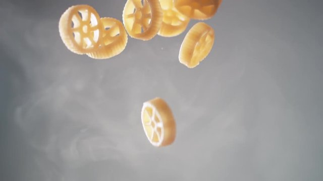 Camera follows cooking insalatonde pasta in boiling water. Shot with high speed camera, phantom flex 4K. Slow Motion.