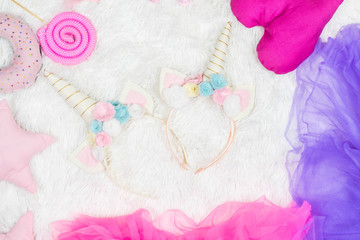 Unicorn headband with flowers and horn on white background. Costume for children.