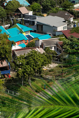 Fototapeta premium Elevated view of colorful houses in residential area of Pattaya, Thailand