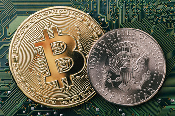 Bitcoin and one dollar on a computer chip close-up