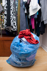 Bag of clothes in closet
