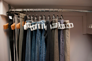 Pants hanging organized in closet
