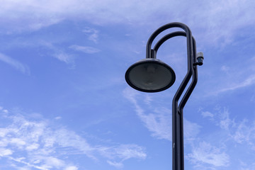 Street lamp or light pole with blue sky background