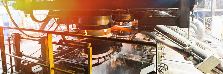 Fiberglass production industry equipment at manufacture background