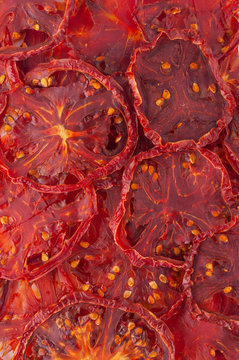 Dried tomato slices (chips) background.