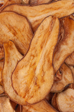Dried pear slices (chips) background.