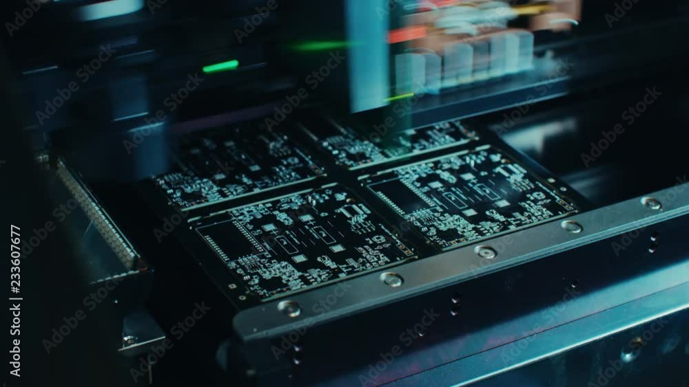 Poster factory machine at work: printed circuit board being assembled with automated robotic arm, surface m