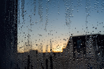 drops on glass at sunset