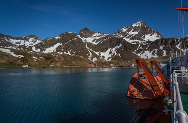 Lifeboat on board a ship in the harbor in front of Grytviken Whaling Station on South Georgia.
