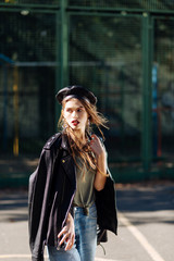 Close up of pleasant appealing young model wearing silver accessories