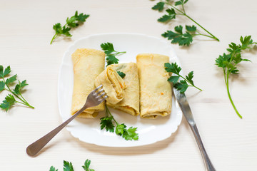 thin fried pancakes stuffed with stewed cabbage