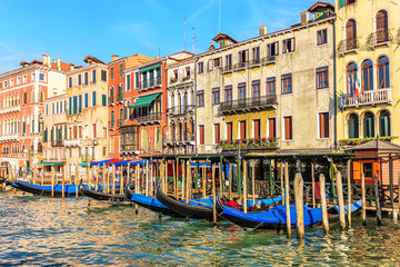 Fototapeta na wymiar Street cafe in Venice on the pier of gondolas in Grand Canal, It