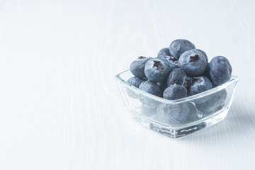 Fresh blueberries in a glass cup
