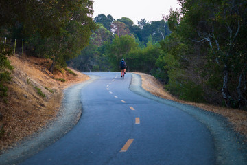 Cyclist on a winding road