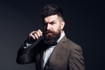 I prefer a barber to a hair stylist. Mens fashion. Man with long beard in business wear. Business as usual. Bearded man after barber shop. Fashion industry. Being a business person