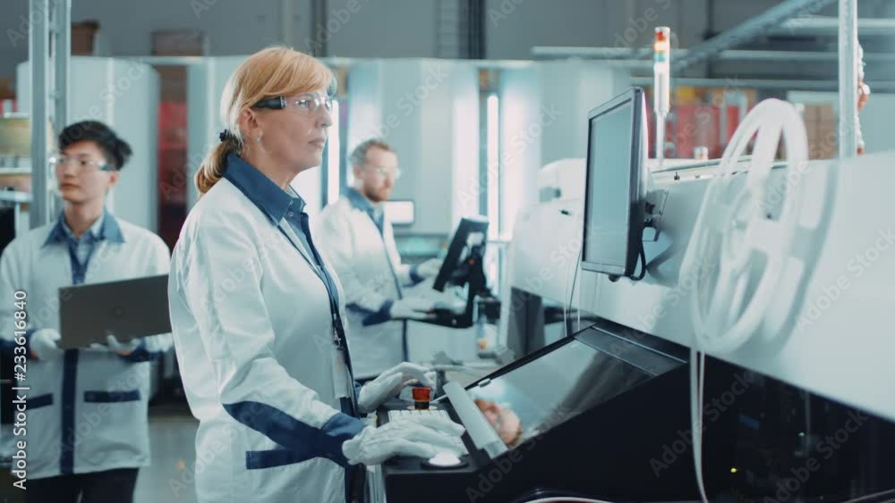 Poster on high tech factory female engineer uses computer for programing pick and place electronic machiner
