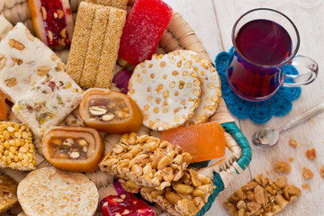 Halawet Al Mawlid Al Nabawi - Collection of Candies and Sweets with cup of tea