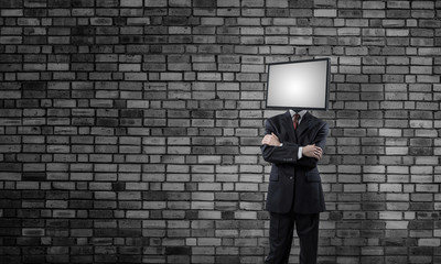 Businessman with TV instead of head.