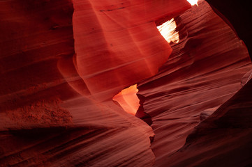 Fototapeta na wymiar Brilliant colors of Upper Antelope Canyon, the famous slot canyon in the Navajo reservation near Page, Arizona, USA. Beautiful view of amazing sandstone formations in the famous antelope canyon