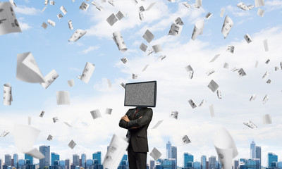 Businessman with TV instead of head.
