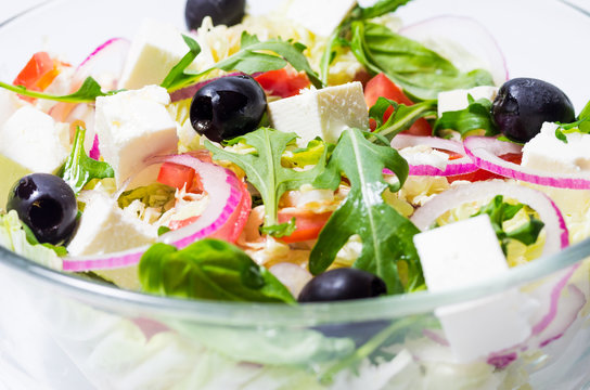 Olive on top of salad. Olive and Tofu Cube.