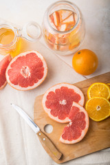 sliced orange and grapefruit on the table