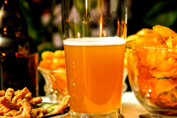 Beautiful evening composition with beer and snacks. Beer, potato chips, flips, integral breadsticks. Nice for parties, celebrations,holidays.