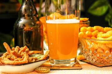 Beautiful evening composition with beer and snacks. Beer, potato chips, flips, integral breadsticks. Nice for parties, celebrations,holidays.