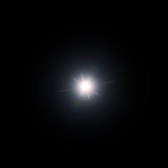 Isolated realistic lens flare visual effect on black night background. Space star. 