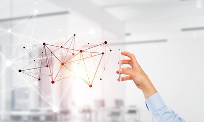 Business and technology concept with networking grid and man using device