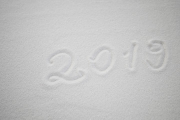 Fototapeta na wymiar 2019 written on the snow. Happy new 2019 year. Empty space for your text