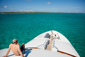Obraz premium High angle view of man relaxing on yacht in sea