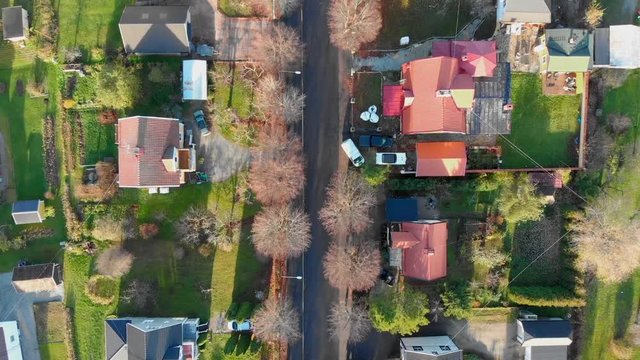 Top-view passing over an all&radic;&copy; with colourfull huses on each side. Filmed in realtime at 1080p.