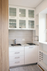 Fototapeta na wymiar small white kitchen