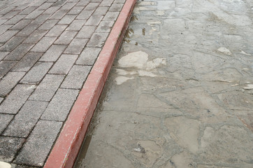 sidewalk of an urban street, sidewalk of bricks in an urban street