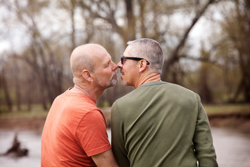 Obraz premium Mature couple kissing outdoors
