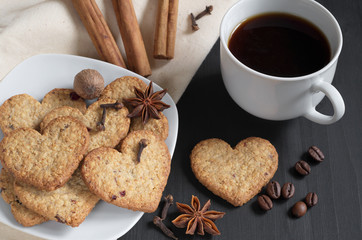 Heart-shaped cookies, coffee and winter spices