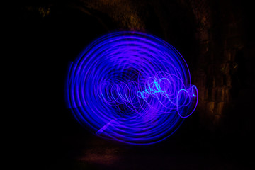 Colorful Light Painting Neon Motion effect.  Using a light up flashing kids sword with a long exposure at night.