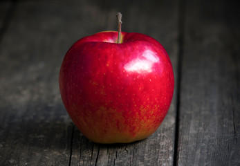 red apple on a wooden background