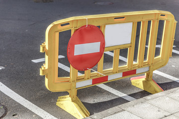 Forbidden sign the passage placed on a yellow barrier