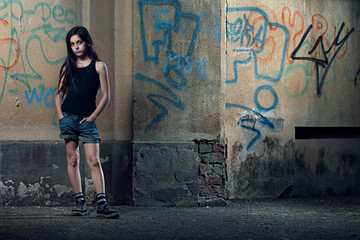 Portrait of girl standing against wall © Cavan for Adobe